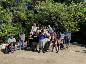Group photo of students and Allies on a sunny day at the Nittany Lion Shrine 
